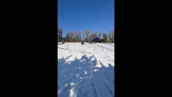Rare coastal snow turns hill into sledding spot in Murrells Inlet, South Carolina, USA