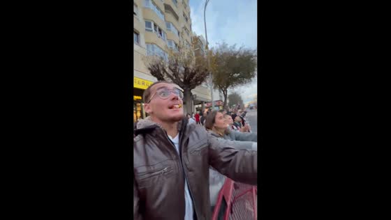 Man catches candy with mouth during parade in Cadiz, Spain