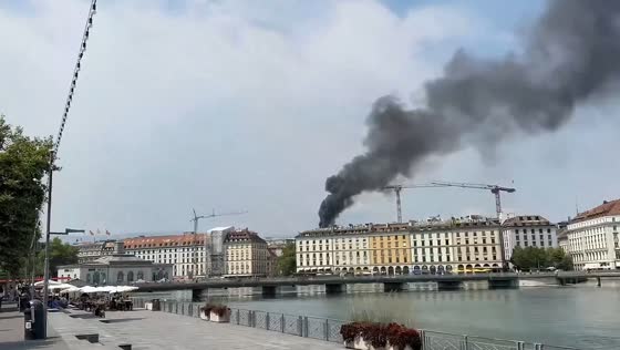 Thick smoke rises from rooftop fire in central Geneva, Switzerland