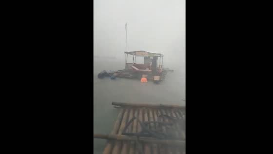 Residents battle strong winds and floods to save floating cottages at Matabungkay Beach