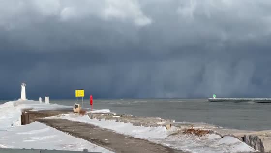 Rapidly intensifying winter storm at Sodus Point Lighthouse, New York, USA