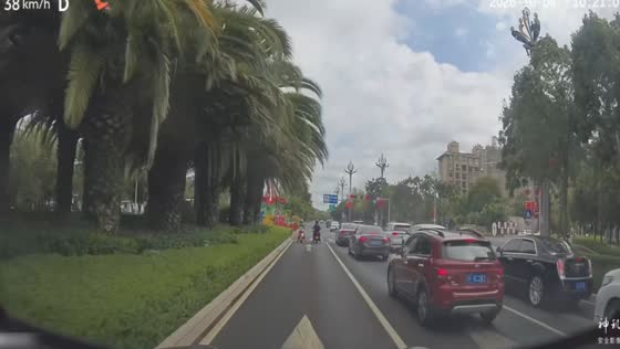 Motorcycle passenger falls as the rider starts moving at an intersection in Sichuan, China