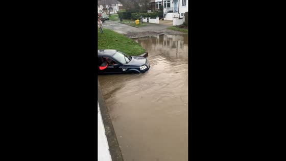 Severe flooding submerges car beneath bridge in Birmingham, UK