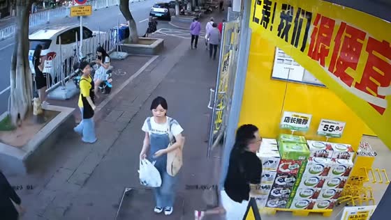Man accidentally crashes into store's glass wall in Beijing, China