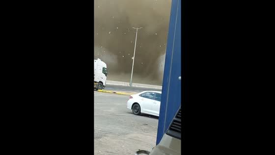 Dust devil swirls alongside Saudi road