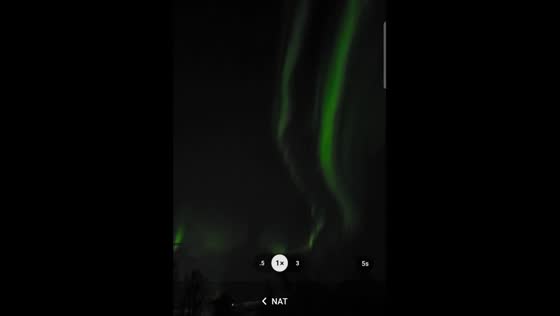 Enchanting Northern Lights illuminate Tromso's night sky in mesmerizing green hues
