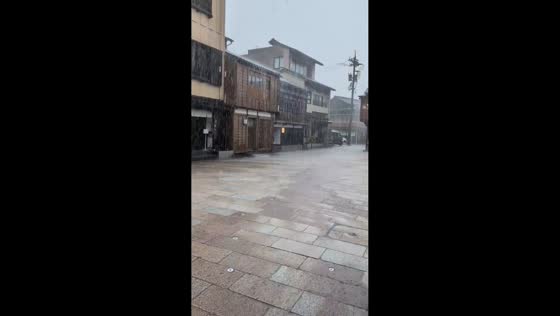 Heavy rain soaks concrete streets in Kanazawa, Japan