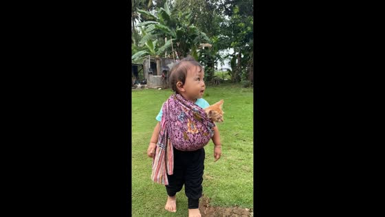 Adorable one-year-old plays 'mom' to cat in heartwarming video