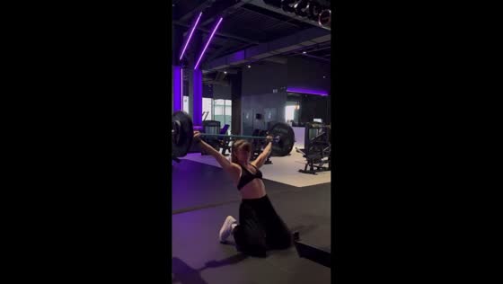 Weightlifter loses balance during overhead lift in St. Petersburg, Russia