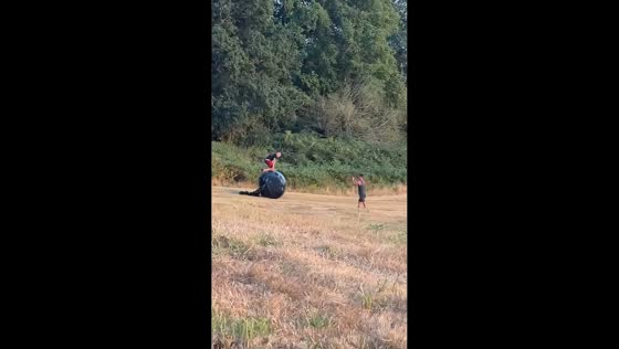 Men caught in mishap as silage bale rolls in England, UK,