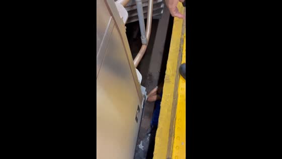 Intoxicated man rescued after falling between train cars in New York, USA