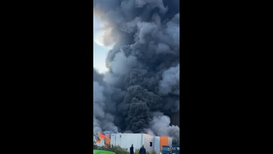 Thick smoke rises from warehouse complex after drone strike in St. Petersburg, Russia