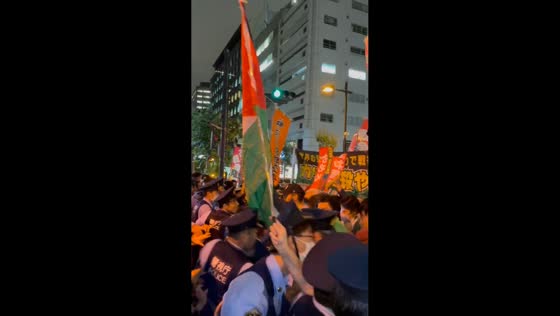 Police contain protesters outside Israeli Embassy in Tokyo, Japan