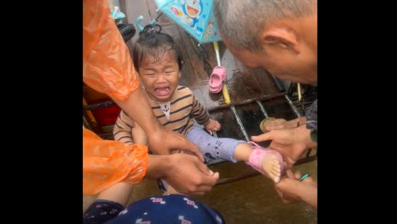 Child's shoe stuck on foot in Yala, Thailand