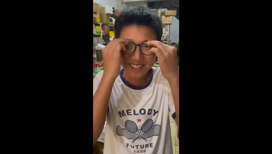 Boy finds a funny way to wear glasses with a missing temple in Shandong, China