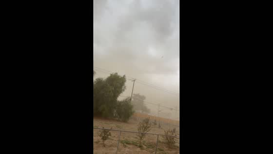 Powerful winds whip up a dense dust storm in Menifee, California, USA
