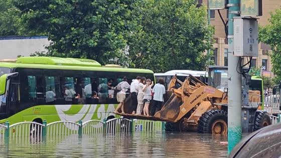 Flood rescue using loader scoop in Hebei, China