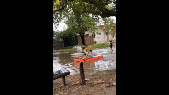 Argentina residents navigate flooded streets by canoe