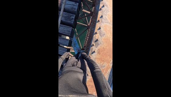 Man completes 22-meter bridge jump challenge into water in Montreal, Canada