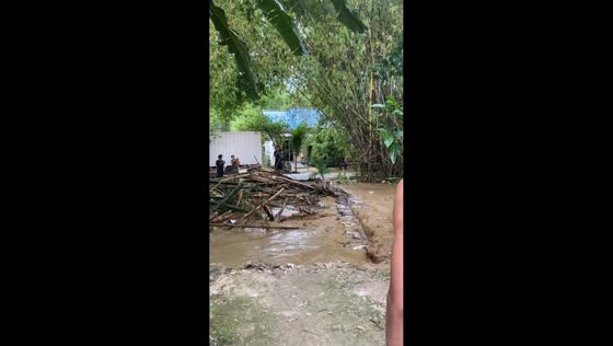 Flood destroys bamboo bridge in Tuban, Java, Indonesia