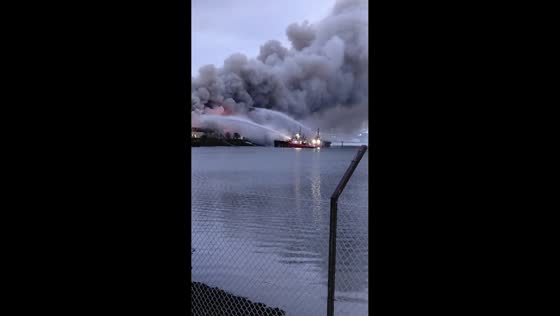 Scrapyard fire sends thick smoke over in Belfast Harbour, Northern Ireland, UK