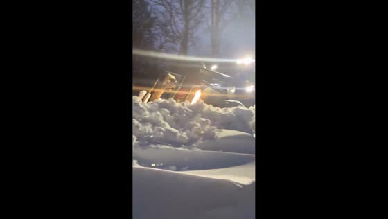 Farm tractors clear deep snow during Storm Goretti in Scotland, UK