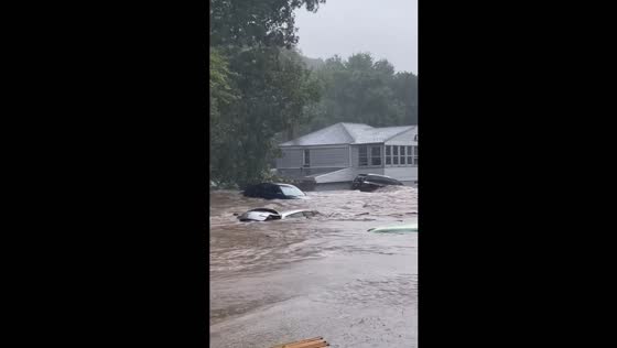Floodwaters wash vehicles and roads away in Oxford, Connecticut