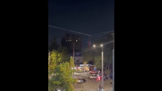 Man dressed as Spider-Man hangs above road in Makhachkala, Russia