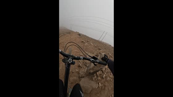 Cyclist loses balance on rough slope in Chorrillos, Lima, Peru