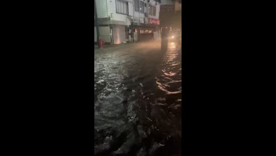 Floodwaters engulf commercial streets during Typhoon Dujuan in Motoyawata, Japan