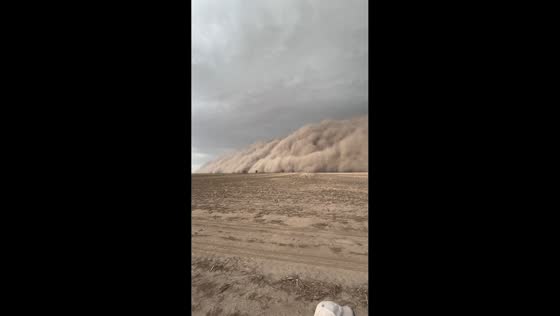 Duststorm approaches tractor in Santiago del Estero, Argentina