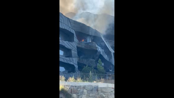 Dense smoke billows from luxury residential complex during major fire in Ordino, Andorra