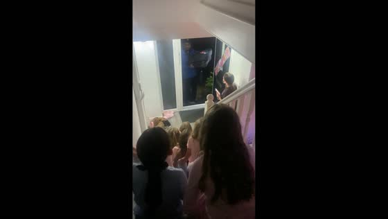 Girls greet pizza delivery with playful Domino’s chant trend in Essex, England, UK