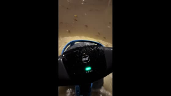 Motorcycle ride through flooded road in Anhui, China