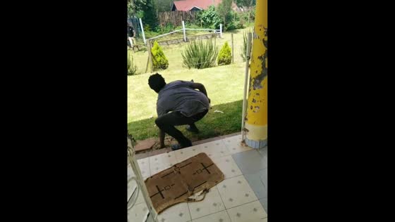 Stone-throwing confrontation between two men in Kericho, Kenya