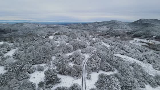 Fresh snowfall blankets the Prades Mountains during a cold Christmas spell, Catalonia, Spain