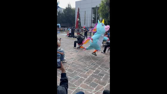 Unicorn mascot tumbles during obstacle race in Mexico