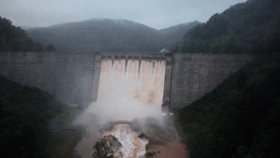 Water overflowing over dam during flood in Poland