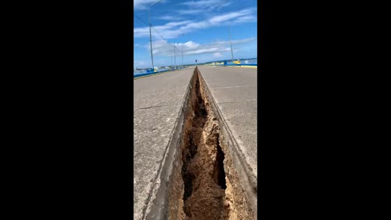 Large road fissure seen after magnitude 6.9 earthquake in Cebu, Philippines
