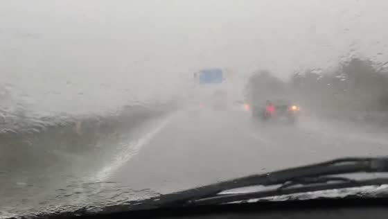 Heavy rain causes difficult driving conditions in Alicante, Spain