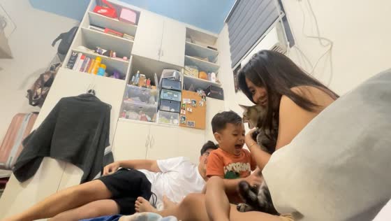 Boy reacts in disgust to cat’s bad breath in Laguna, Philippines