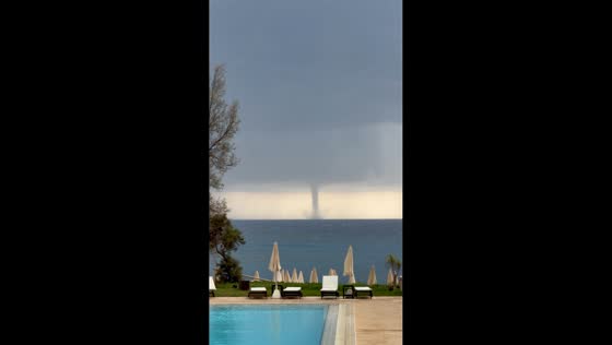 Powerful waterspout swirls off coastline during severe storm in Ayia Napa, Cyprus