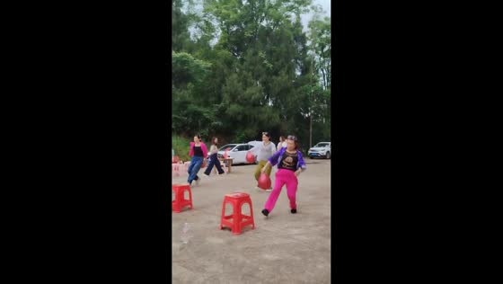Chair breaks during balloon-popping game in Shanghai, China