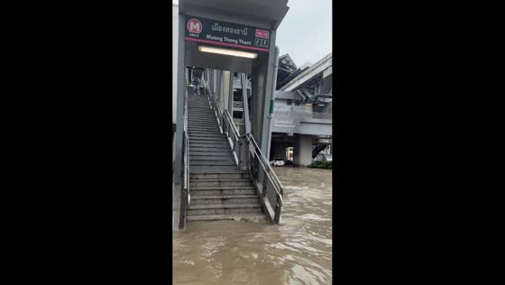 Rising floodwaters submerge roads and MRT station entrance in Bangkok, Thailand