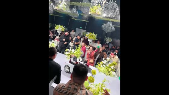 Ring bearer falls asleep on toy car at wedding in Heilongjiang, China