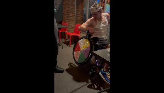 Friend turns wheelchair into fortune wheel for hilarious moment