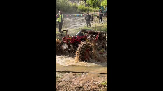 Off-road buggy powers through deep mud pits in Yunnan, China