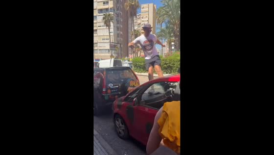 Intoxicated man runs across parked cars and damages windshield in Benidorm, Spain