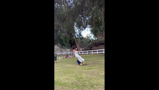 Woman tripped by playful slide tackle during backyard soccer in Los Angeles, USA