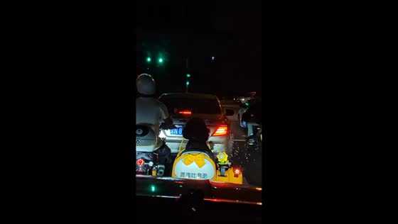 Dog patiently waits on motorcycle sidecar at traffic light in Beijing, China